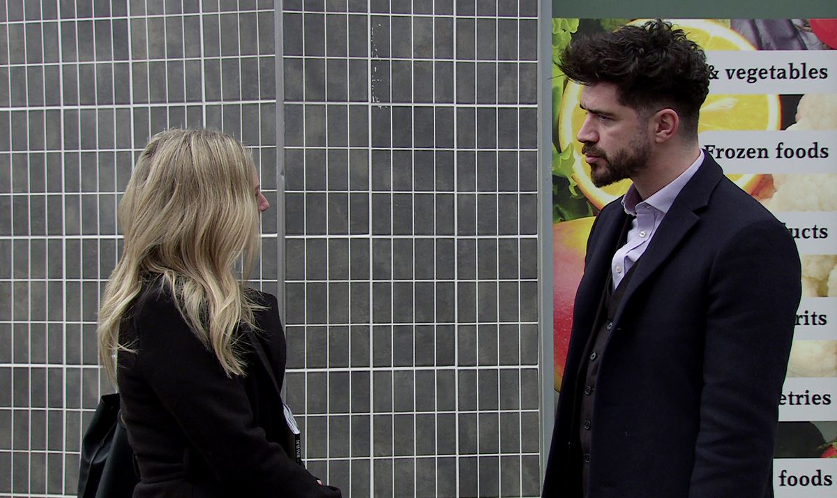 Adam Barlow and Sarah Platt talking outside the corner shop.