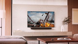 Sony Bravia 8 wall mounted in a modern living room with a soundbar underneath