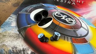 Google Pixel Buds Pro in-ear headphones with case on ELO album cover