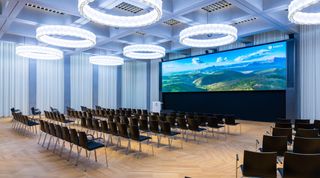 A Zurich meeting space with a scenic landscape on a huge LED wall provided by WSDG.
