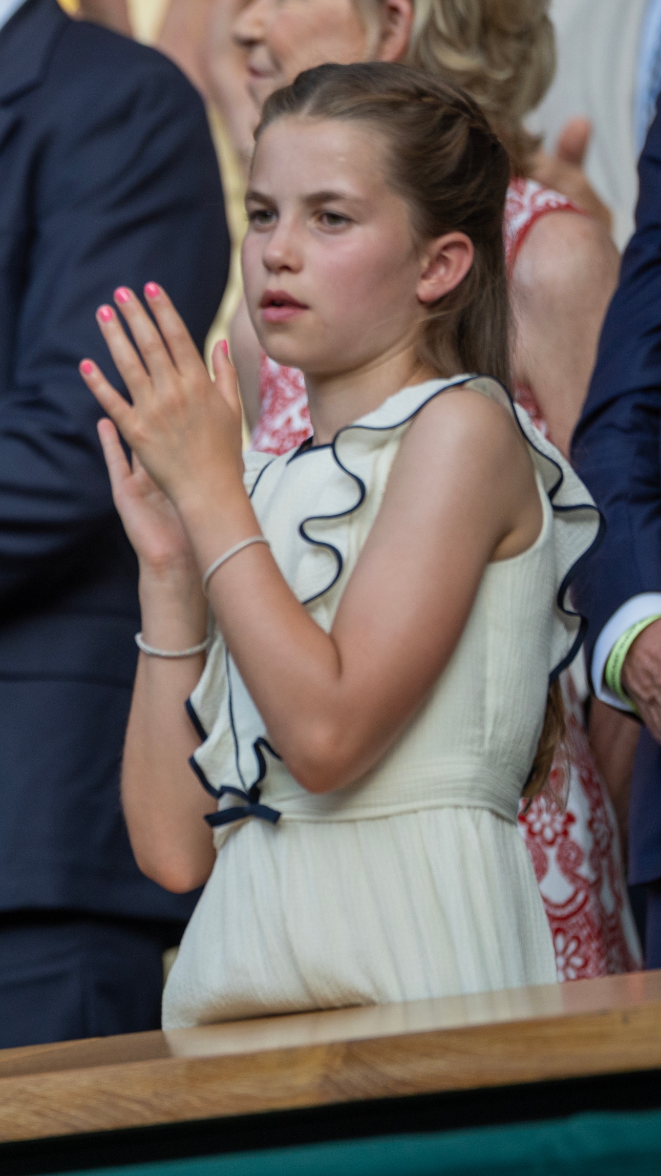 Princess Charlotte claps as she watches the presentation ceremony of the Gentlemen's Singles Final at Wimbledon on July 13th, 2025