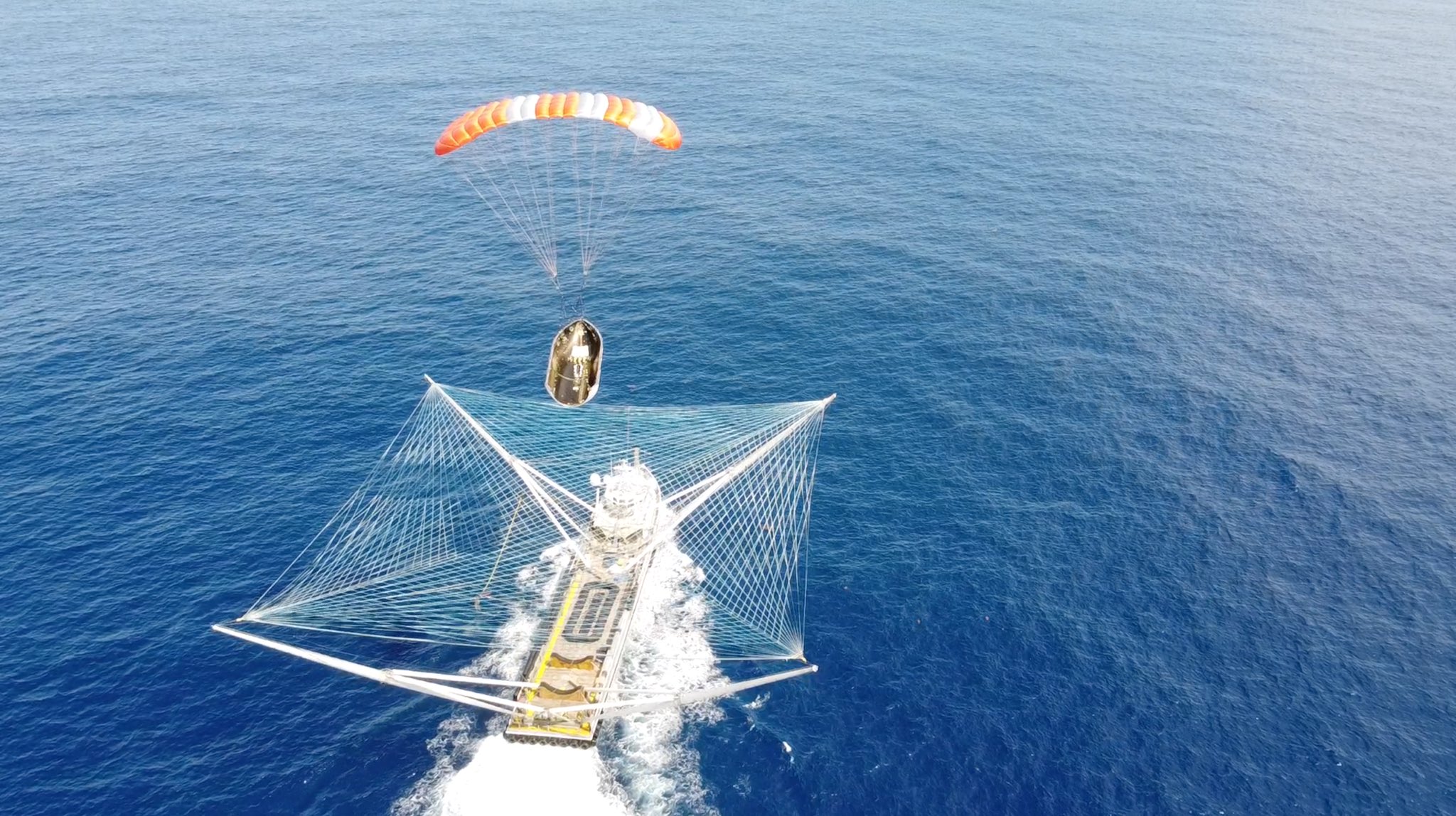 Watch SpaceX boat catch falling payload fairing in giant net