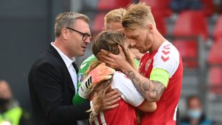 Simon Kjaer comforts Christian Eriksen’s partner Sabrina Kvist Jensen