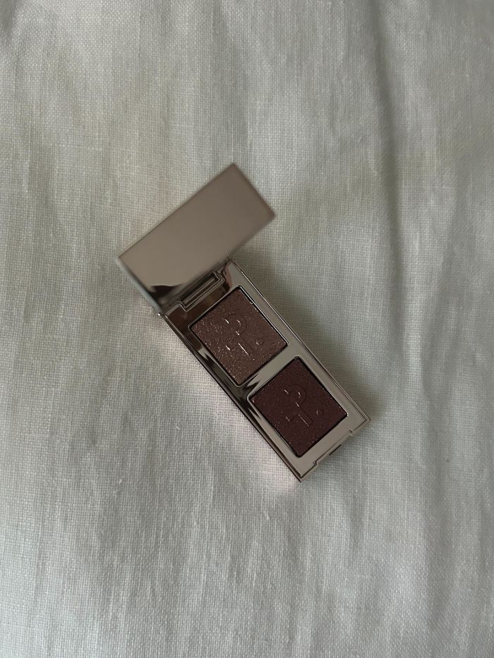Patrick Ta Major Dimension Eye Illusion Eyeshadow Duo on a white linen background