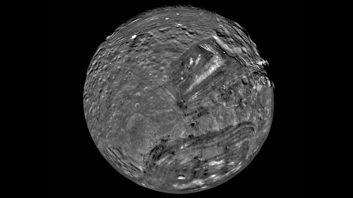 Uranus&#039; moon Miranda is shown in a computer-assembled mosaic of images obtained Jan. 24, 1986, by the Voyager 2 spacecraft. Miranda is the innermost and smallest of the five major Uranian satellites, just 480 kilometers (about 300 miles) in diameter. Nine images were combined to obtain this full-disc, south-polar view.