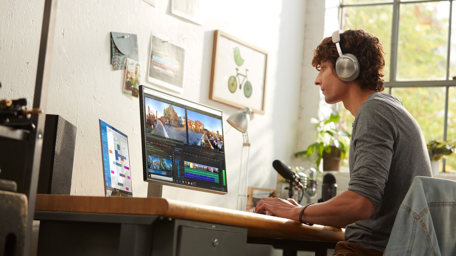 Man using a PC and laptop to record music