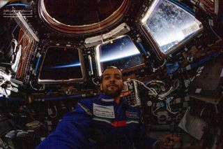 United Arab Emirates astronaut Hazzaa Ali Almansoori poses for a selfie in the Cupola observation module of the International Space Station on Oct. 2, 2019 during the UAE's first human spaceflight.