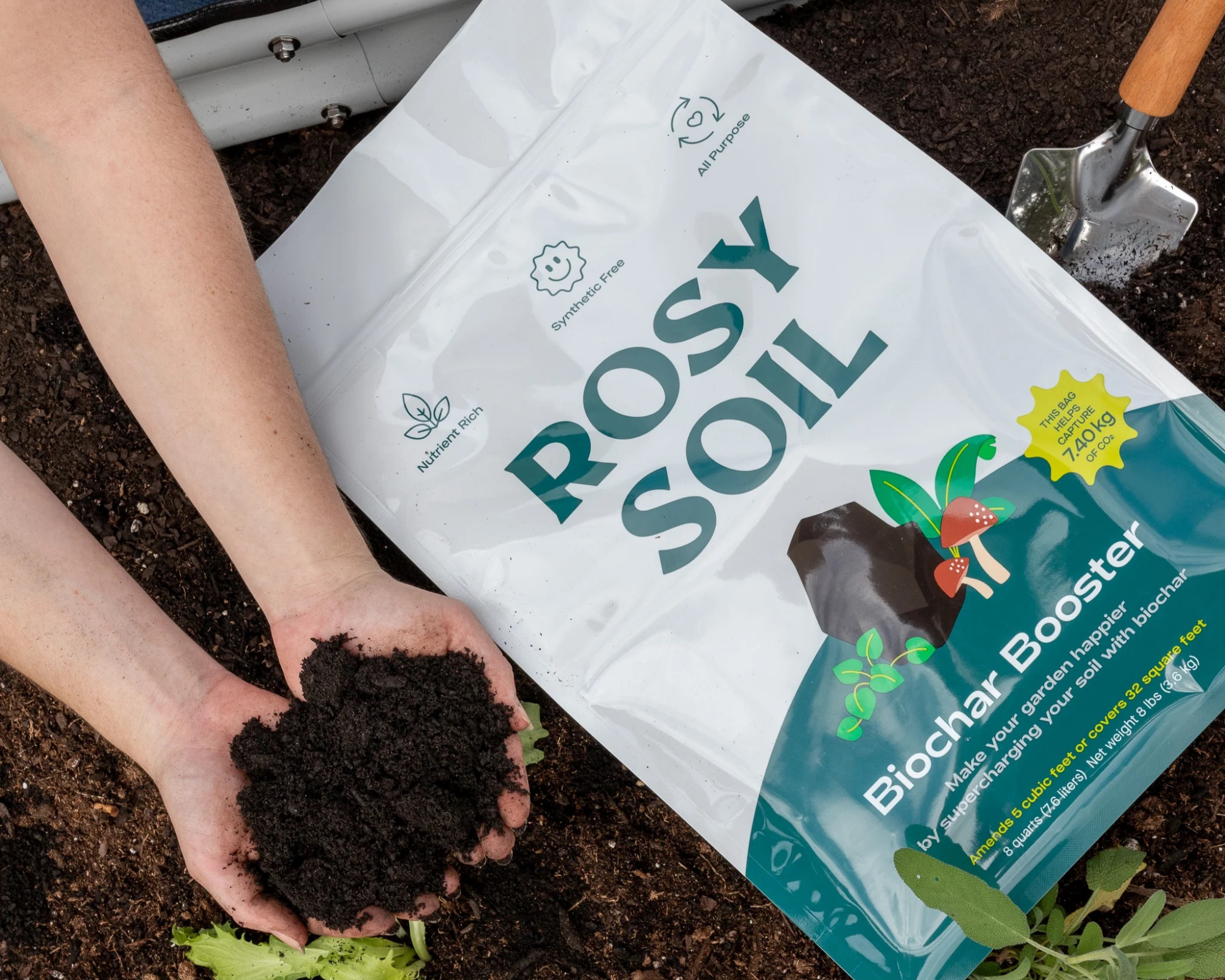 Rosy Soil biochar booster in a garden bed