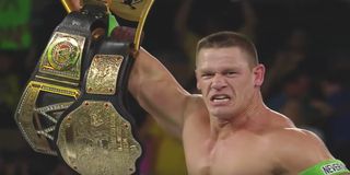 John Cena capturing the vacated WWE Championship and World Heavyweight Championship in 2014