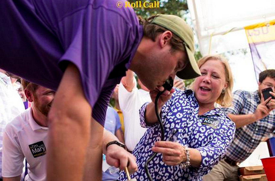 Senator Mary Landrieu aids keg stand at football game