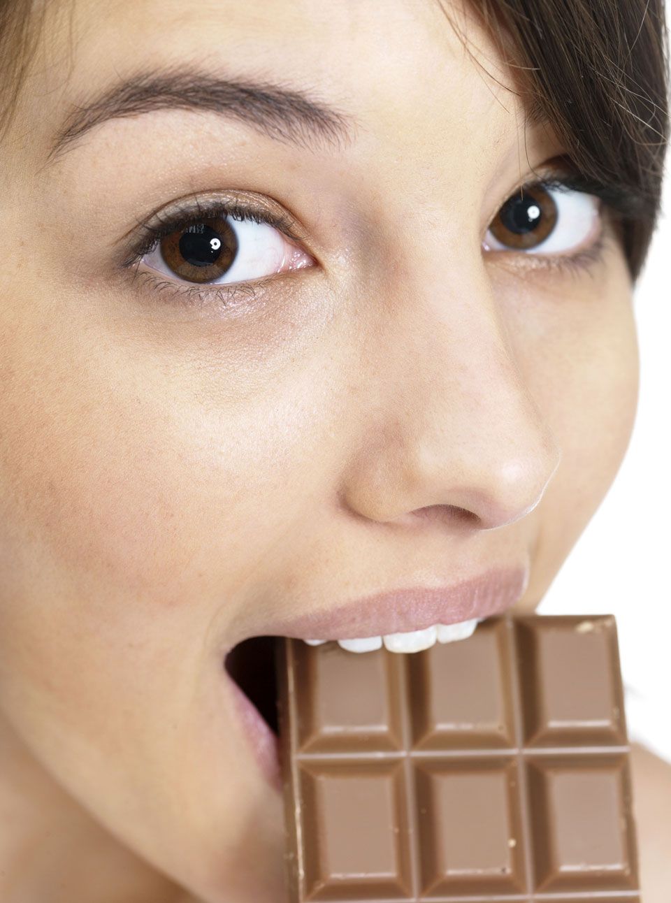 Woman eating chocolate