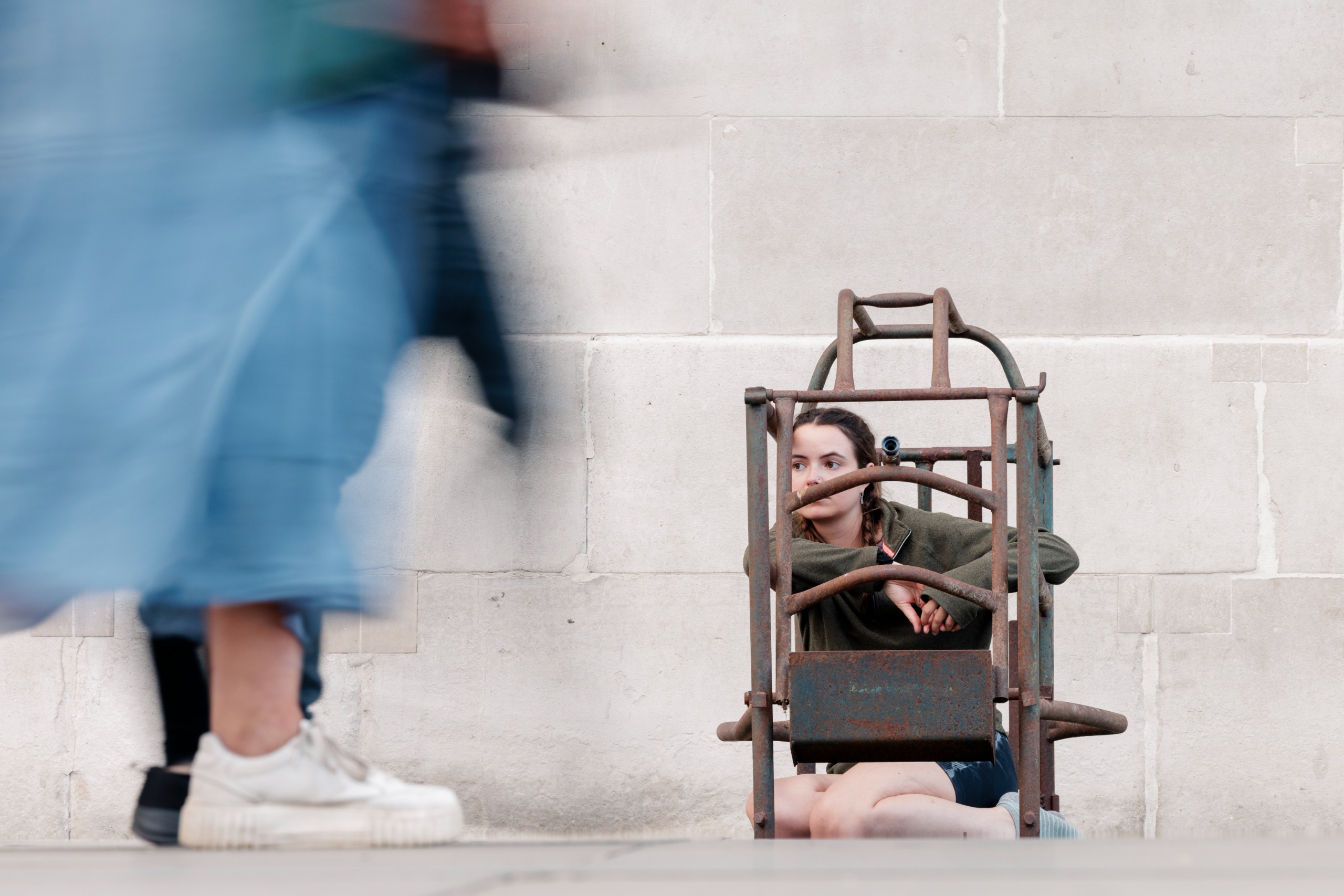 Animal rights activist Michelle Farnham protests in a cage outside the National Gallery at Trafalgar Square on September 11, 2026 in London, England.