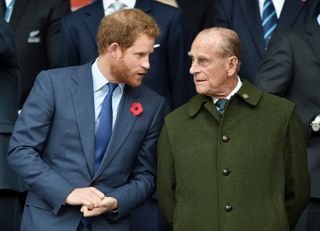 Prince Harry's decision described as a "slap in the face" to the Queen, seen here with Prince Philip, Duke of Edinburgh attending the 2015 Rugby World Cup Final match