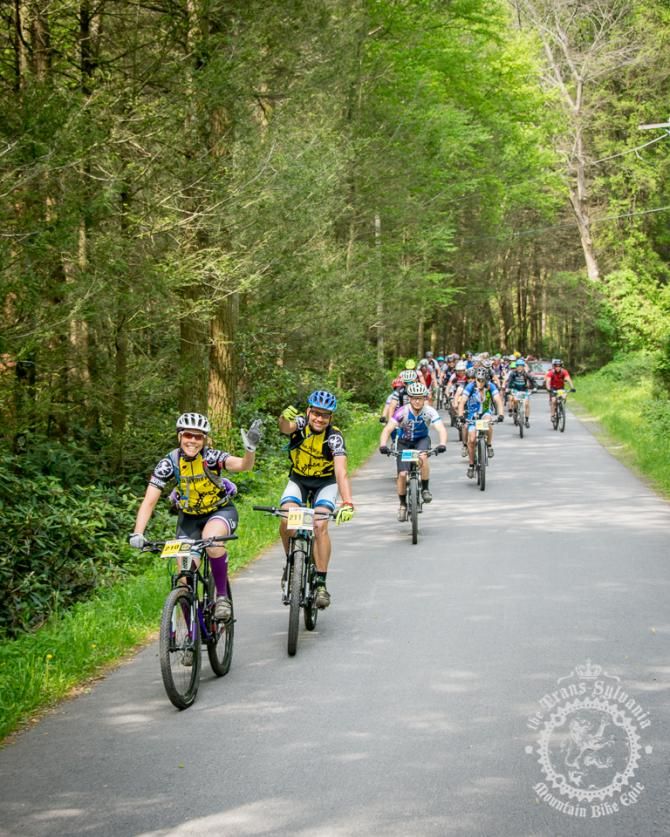 Jessica and Joel Nankman rolling up the hill between enduro stages