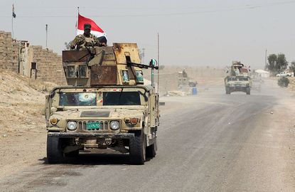 Iraqi forces fight outside Fallujah