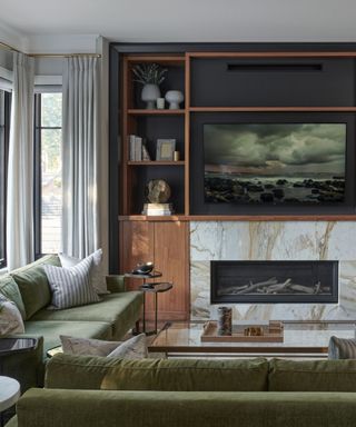 A living room with an entertainment center with a background painted black