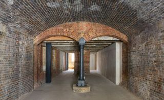 The brick and cast-iron arches at Coal drops Yard