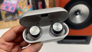 Technics EAH-AZ100 wireless earbuds in case held in hand