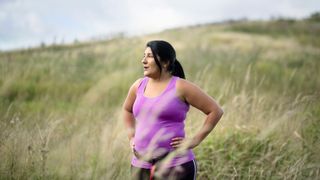 Woman resting after going for a run, experiencing exercise burnout