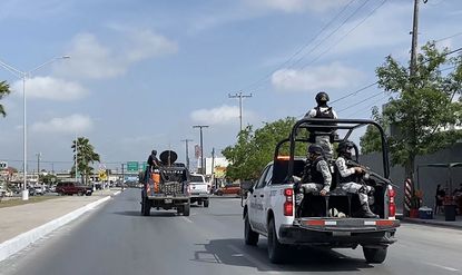 National Guard and military vehicles transfer U.S. citizens citizens kidnapped in Mexico to the U.S.