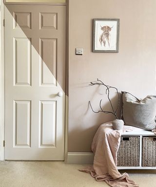 A cream panelled interior door with a brown triangular colour block feature