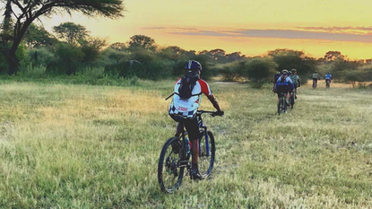 A group of cyclists riding bikes in Botswana