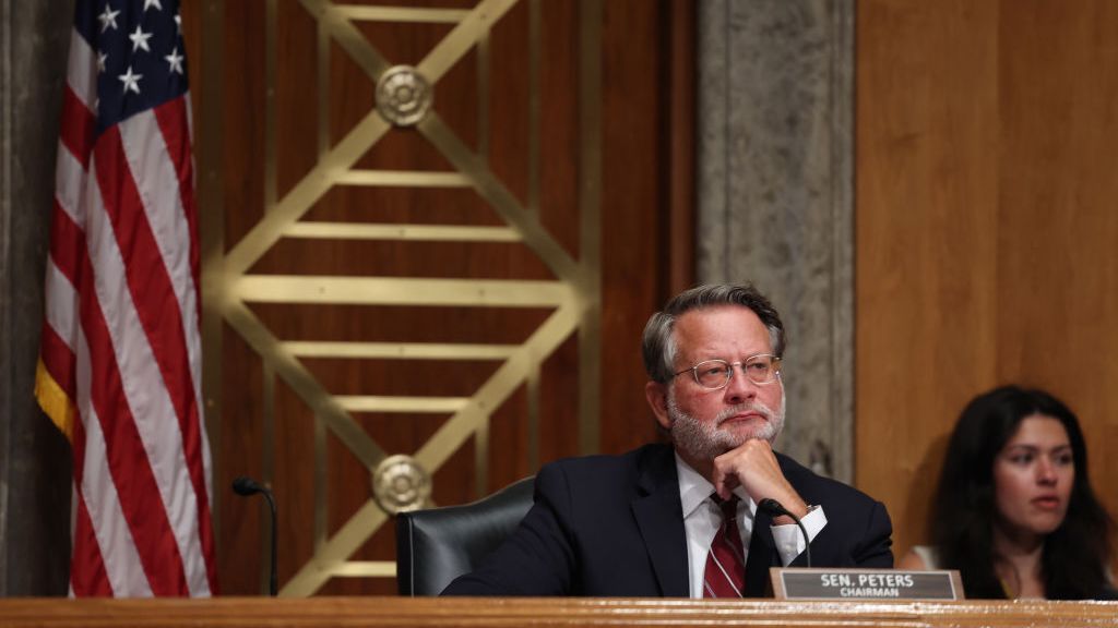 Senator Gary Peters listening at a session in government