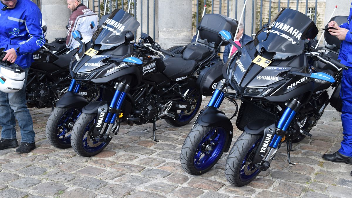 The race support motorbikes had two front wheels to cope with the rough cobbles