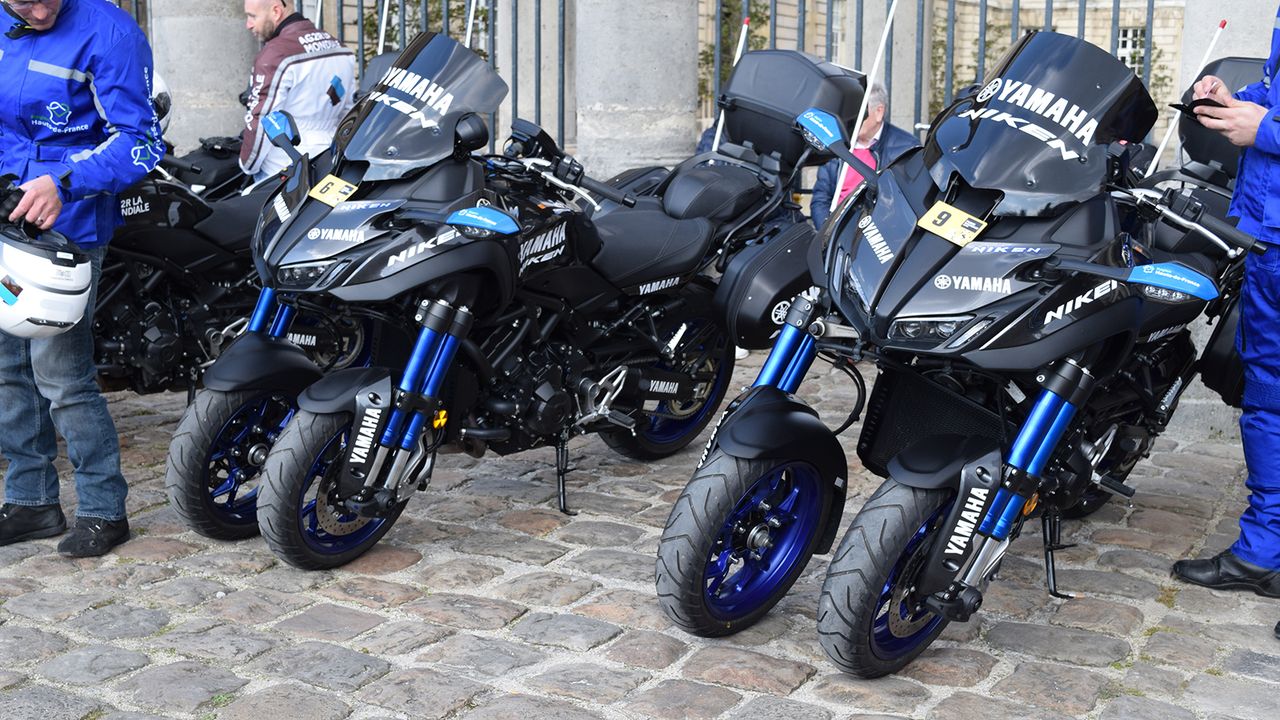 The race support motorbikes had two front wheels to cope with the rough cobbles