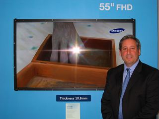 Samsung's LCD business VP, Scott Birnbaum, poses next to the newest 240 Hz 55\
