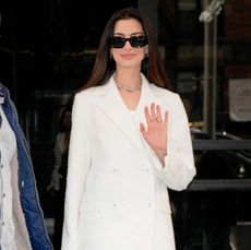 Anne Hathaway in two white outfits