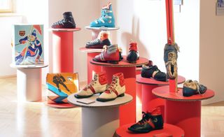 Red cardboard displays with shoes