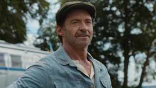 Hugh Jackman smiling in The Sheep Detectives