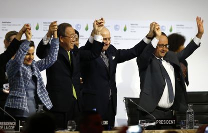 U.N. and French officials celebrate the landmark climate change deal reached in Paris by global leaders.