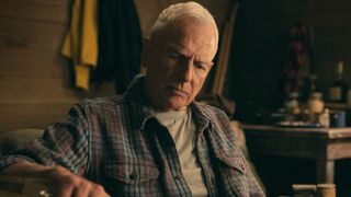 Gibbs looking through a book. 