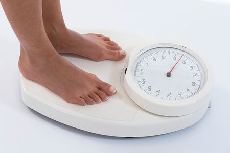 Woman on weight scales