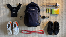 Arrangement of fitness products around a black backpack