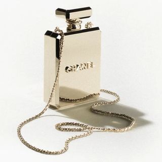 metallic evening bag in shape of Chanel perfume bottle