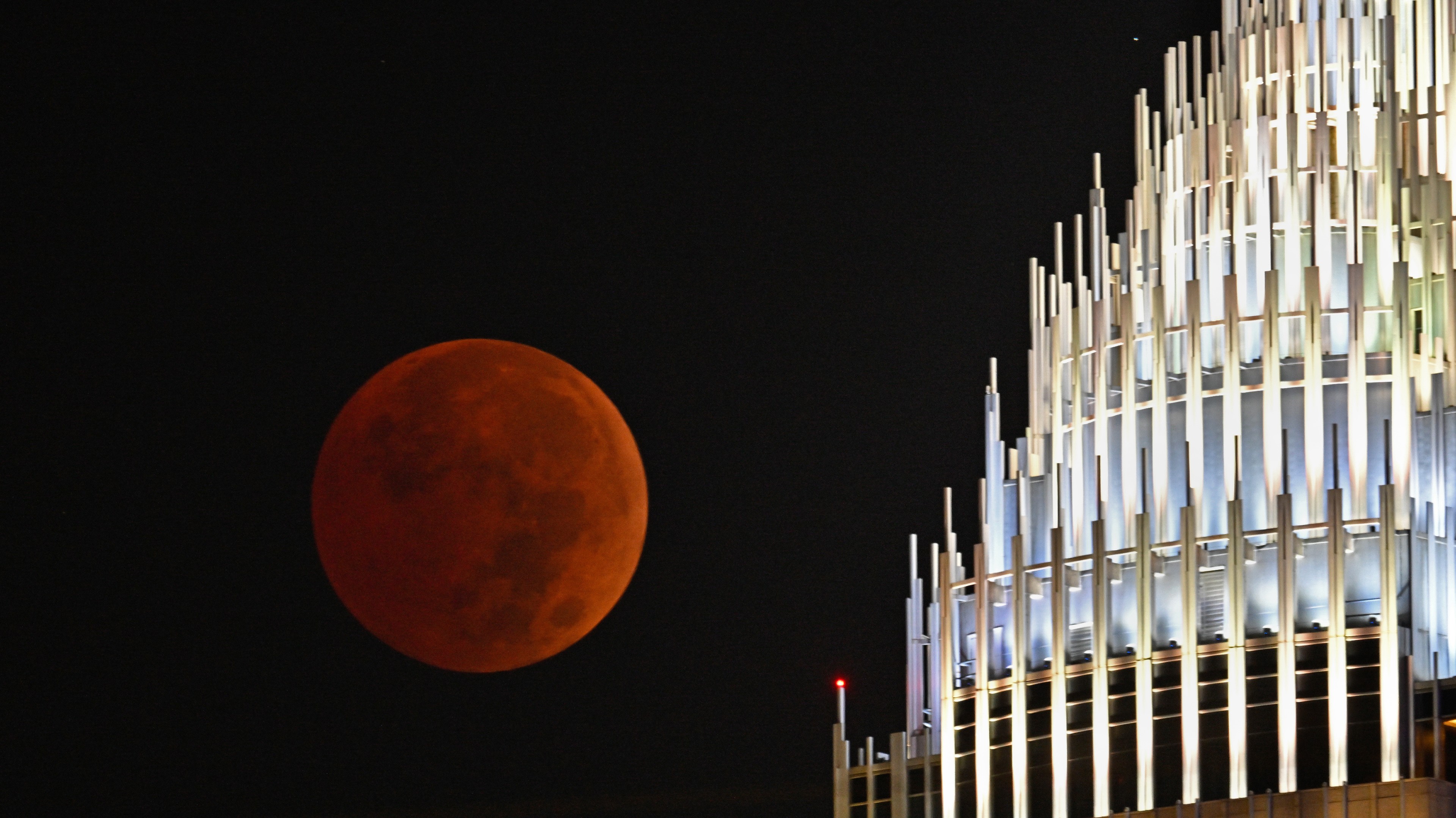 The blood moon rises over Charlotte, North Carolina, on Nov. 8, 2022. (Photo by Peter Zay/Anadolu Agency via Getty Images)