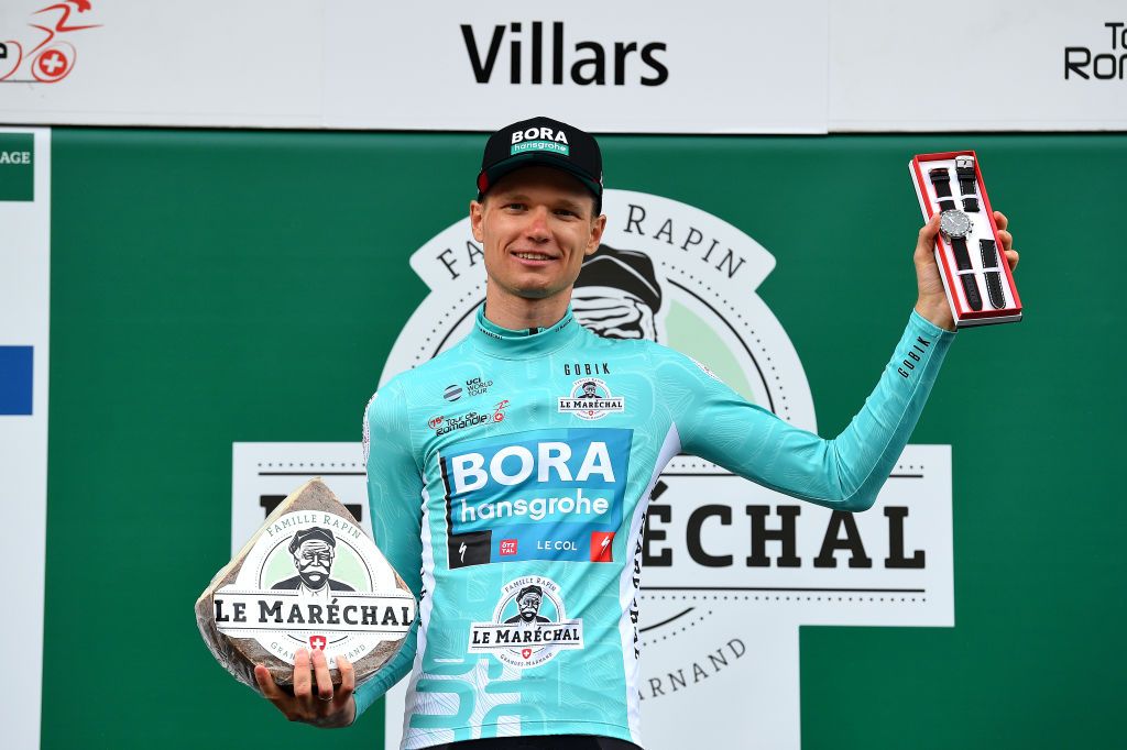 VILLARSSUROLLON SWITZERLAND MAY 01 Aleksander Vlasov of Russia and Bora Hansgrohe Team celebrates at podium as Turquoise Leader Jersey final winner during the 75th Tour De Romandie 2022 Stage 5 a 1584km Individual Time Trial stage from Aigle to VillarssurOllon 1256m ITT TDR2022 on May 01 2022 in VillarssurOllon Switzerland Photo by Dario BelingheriGetty Images