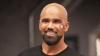 Close-up of Hondo smiling with cheek bandage in S.W.A.T. series finale