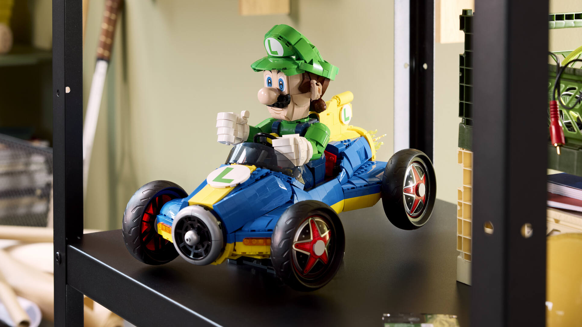 Lego Luigi & Mach 8 set on a shelf, giving a thumbs up