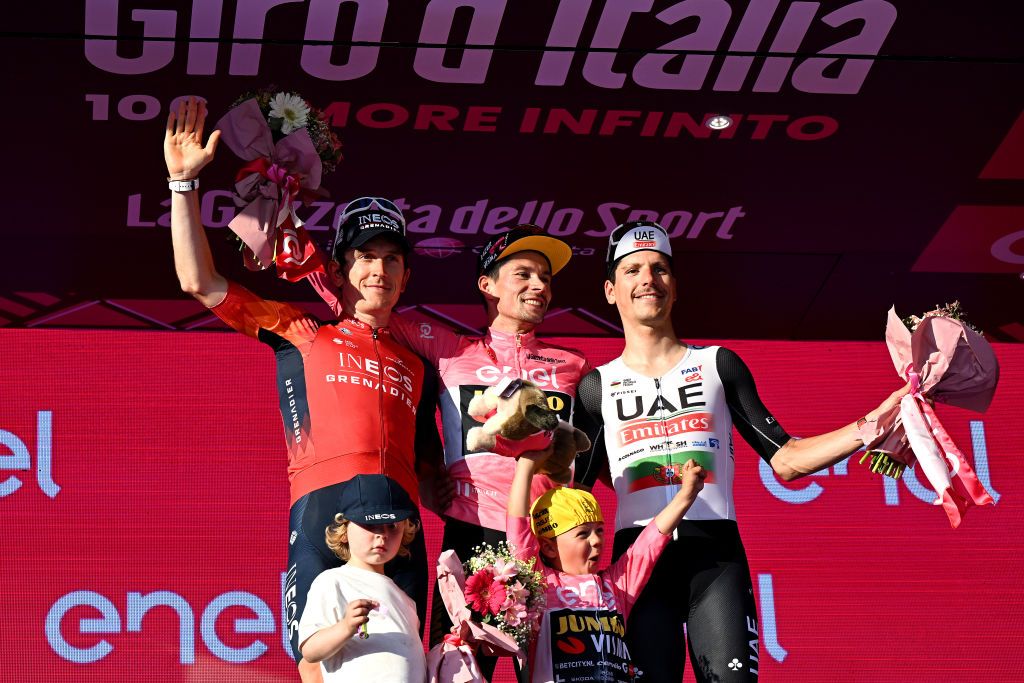 ROME ITALY MAY 28 LR Geraint Thomas of The United Kingdom and Team INEOS Grenadiers on second place race winner Primo Rogli of Slovenia and Team JumboVisma Pink Leader Jersey and Joo Almeida of Portugal and UAE Team Emirates on third place pose on the podium ceremony after the 106th Giro dItalia 2023 Stage 21 a 126km stage from Rome to Rome UCIWT on May 28 2023 in Rome Italy Photo by Stuart FranklinGetty Images