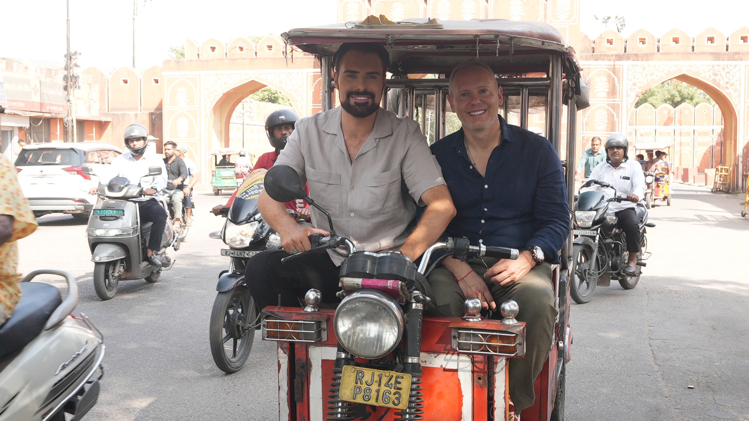 Rob Rinder and Rylan Clark on a Tuk Tuk in Jaipur.