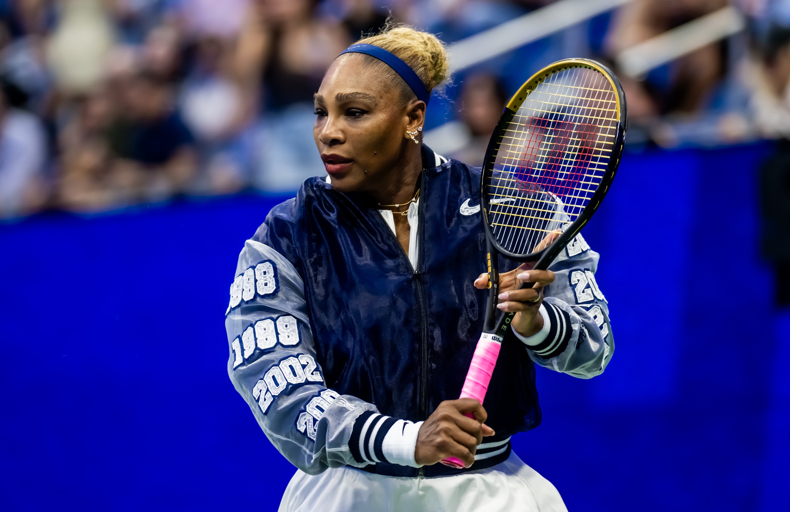 Serena Williams wears a custom Nike jacket to play doubles with sister Venus Williams