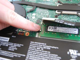 Unclip the arms on either side of the RAM