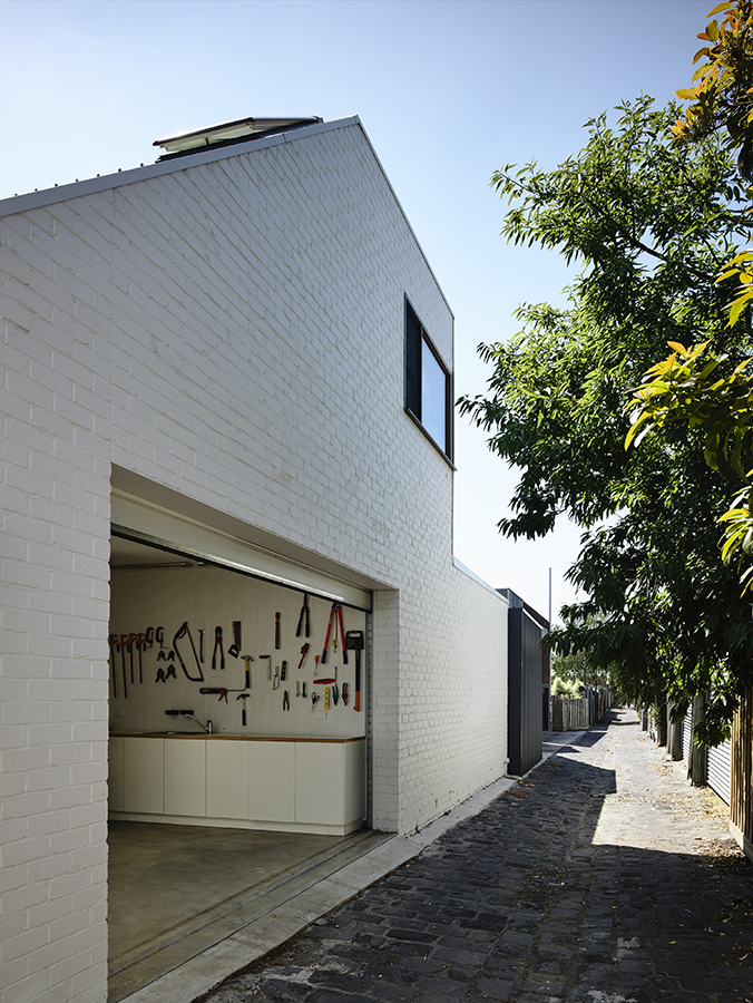 The new building provides a playroom, garage, workshop, laundry and a guest room with en-suite bathroom