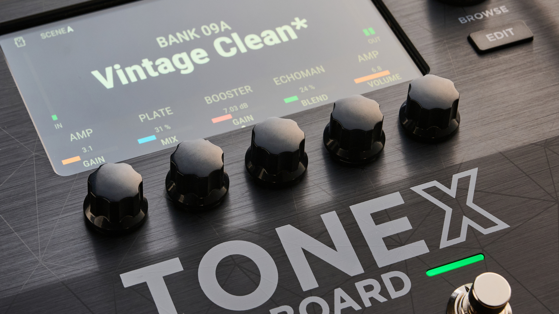 IK Multimedia Tonex Board shot on OSB wood surface.