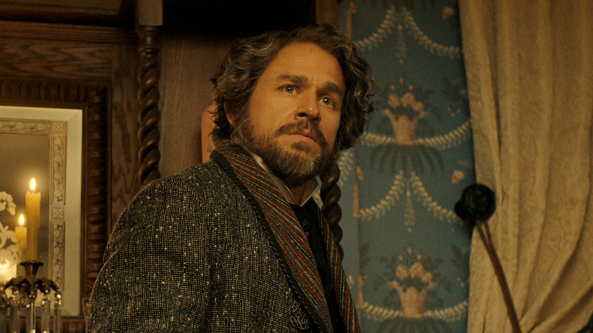 Andrew Borden in front of wallpaper and curtains in episode 401 of Monster: The Lizzie Borden Story