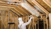 Spray foam being installed into a timber frame home